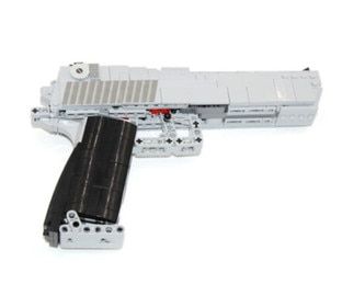 Caliber Gourmet Building Block Handgun Toy has a realistic appearance and working trigger.